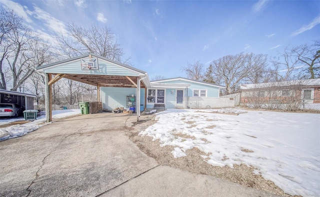 view of front of home featuring a carport