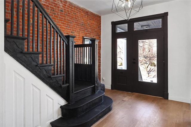 foyer featuring a notable chandelier and hardwood / wood-style flooring