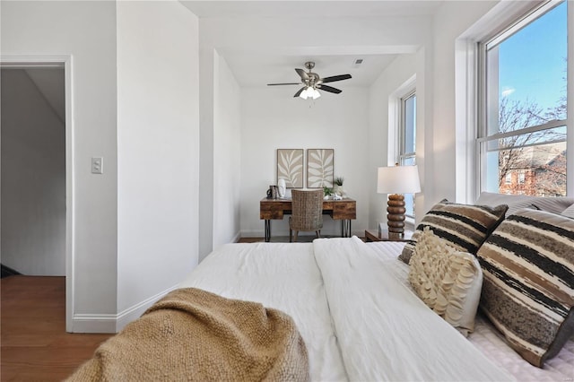 bedroom featuring hardwood / wood-style flooring and ceiling fan