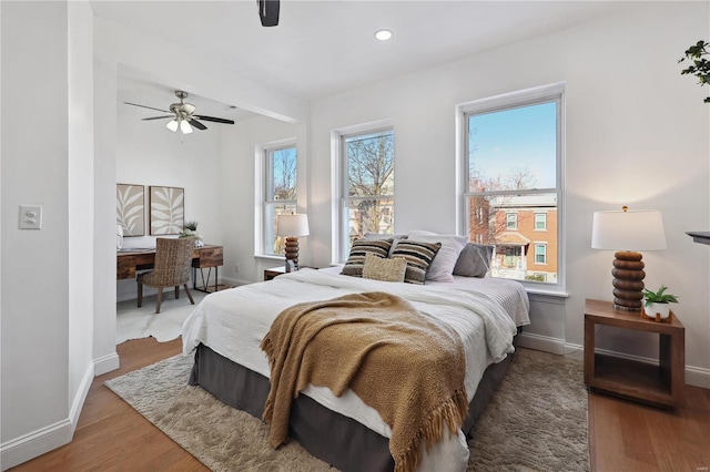 bedroom featuring hardwood / wood-style flooring and ceiling fan