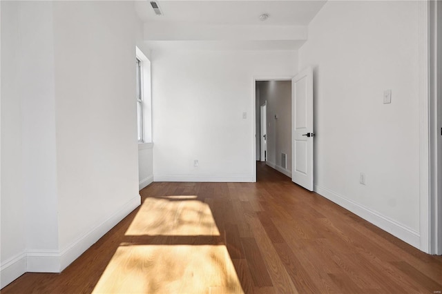 empty room featuring hardwood / wood-style flooring