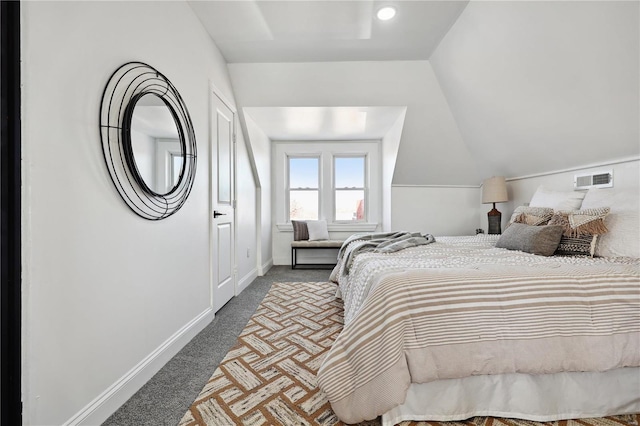 bedroom with vaulted ceiling and carpet flooring