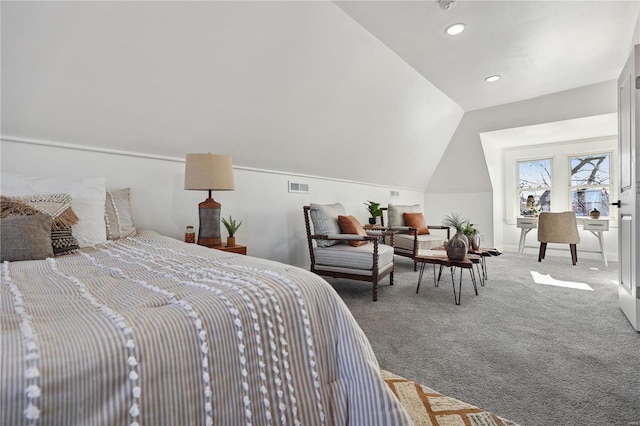 bedroom with lofted ceiling and carpet floors