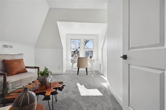 living area featuring vaulted ceiling and carpet floors