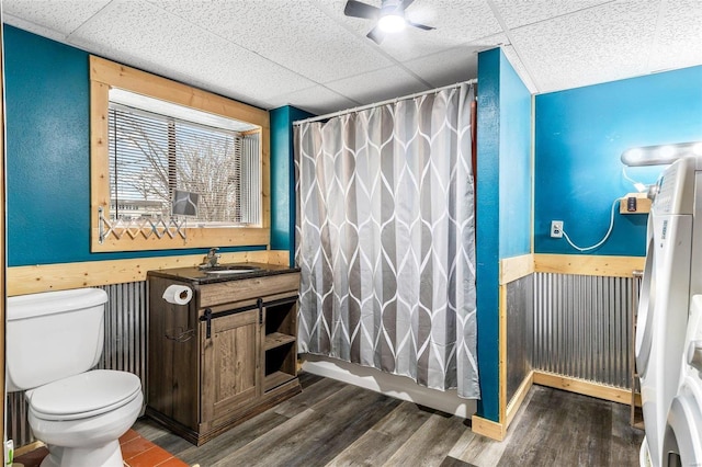 full bathroom with vanity, a paneled ceiling, hardwood / wood-style flooring, and toilet