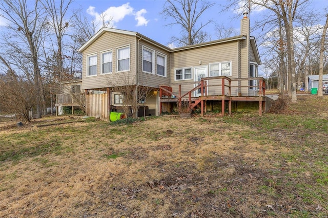 rear view of house with a wooden deck