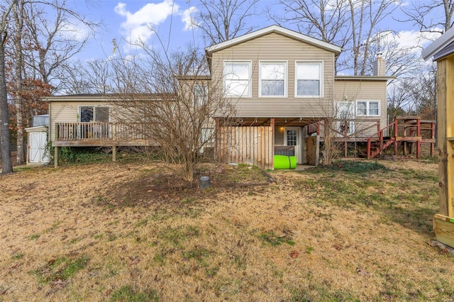 rear view of property featuring a deck