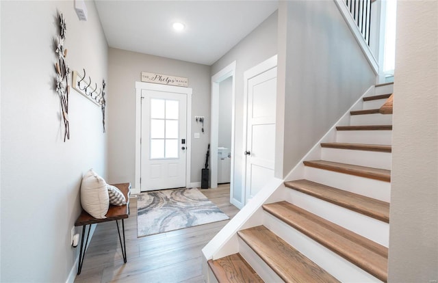 foyer entrance with light hardwood / wood-style floors