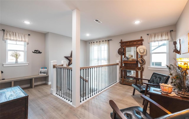 interior space with light wood-type flooring and a wealth of natural light