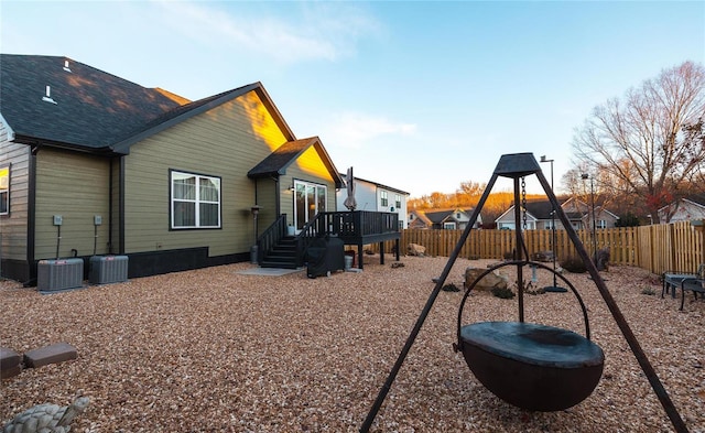 view of playground with cooling unit and a wooden deck