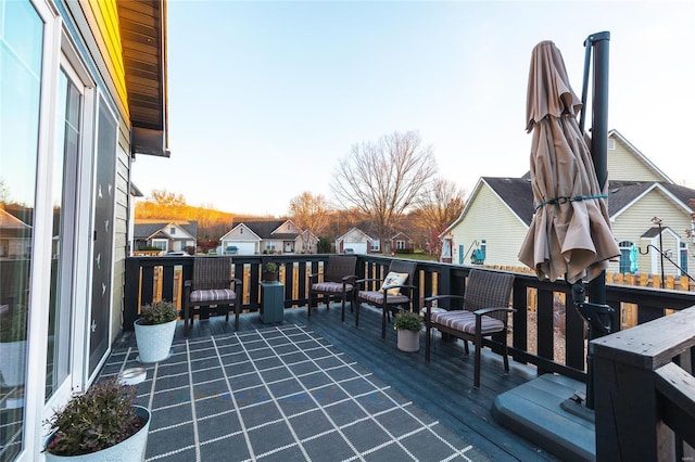 wooden terrace featuring a residential view