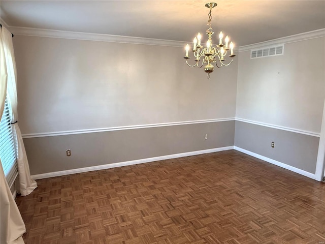 empty room featuring dark parquet flooring, a chandelier, and crown molding