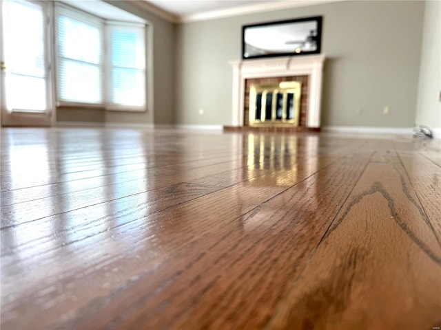 unfurnished living room featuring ornamental molding