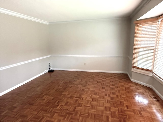 unfurnished room featuring ornamental molding and dark parquet floors