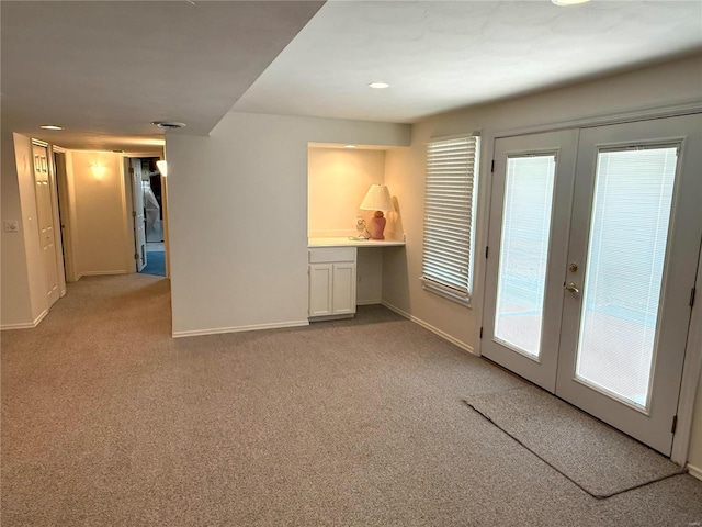 carpeted empty room with french doors