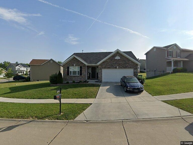 ranch-style house with a front lawn and a garage