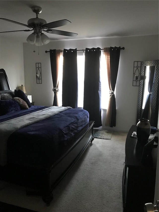 bedroom featuring ceiling fan and carpet floors