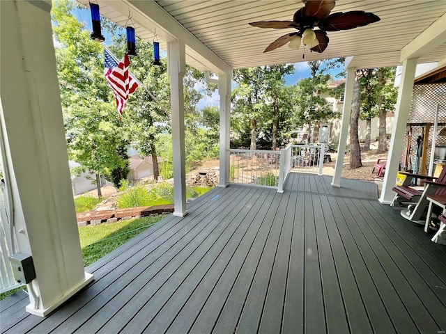 wooden deck with ceiling fan and a porch