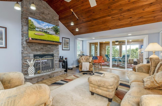 living room with a fireplace, hardwood / wood-style floors, high vaulted ceiling, and wooden ceiling