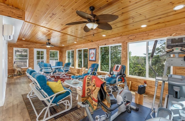 sunroom / solarium with ceiling fan, wood ceiling, and a wall mounted AC