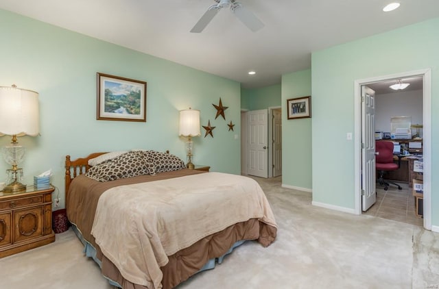 bedroom featuring ceiling fan and light carpet