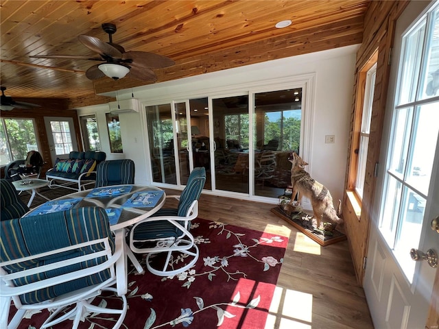 sunroom featuring ceiling fan and wooden ceiling