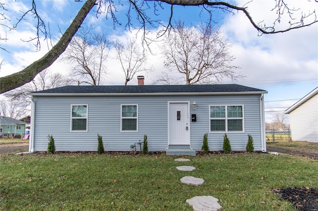 view of front of home with a front yard