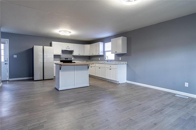 kitchen featuring white cabinets, a center island, sink, and appliances with stainless steel finishes