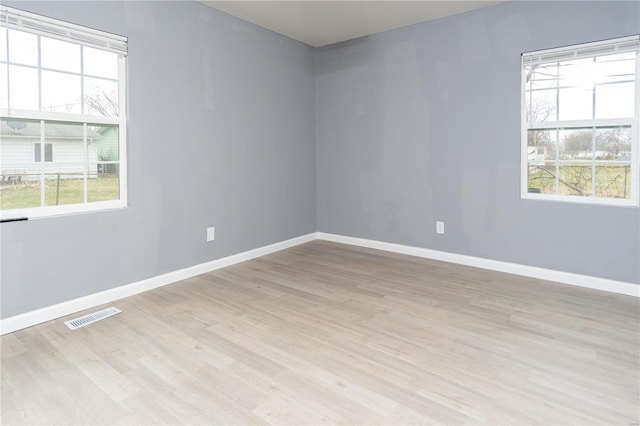 empty room with light wood-type flooring