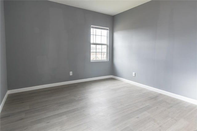 spare room featuring light hardwood / wood-style floors