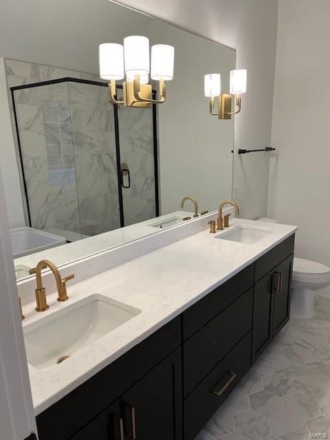 bathroom featuring toilet, a shower with door, an inviting chandelier, and vanity