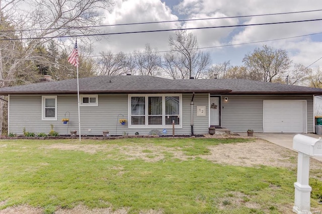 ranch-style home with a garage and a front lawn