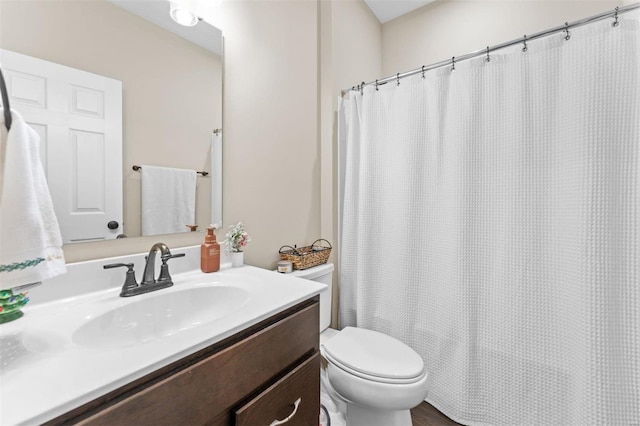 full bath with vanity and toilet