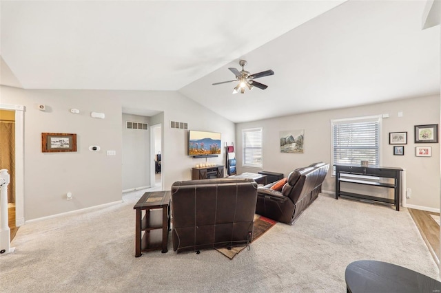 living room featuring light carpet, ceiling fan, and lofted ceiling