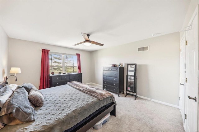 bedroom featuring ceiling fan and light carpet