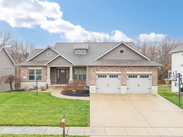 craftsman-style home featuring a garage and a front yard