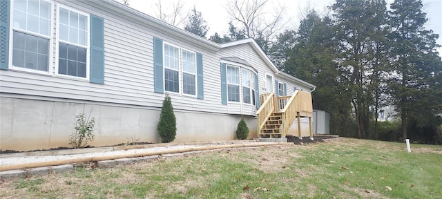 view of home's exterior featuring a lawn