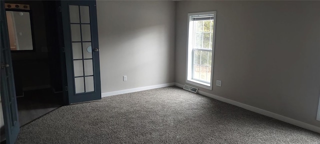 unfurnished room with carpet floors