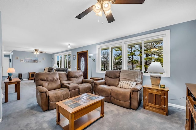 living room with carpet flooring and ceiling fan