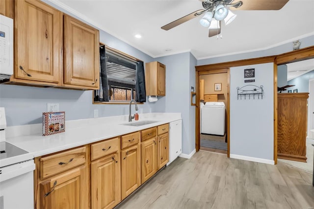 kitchen with light wood-type flooring, white appliances, crown molding, sink, and washer / clothes dryer