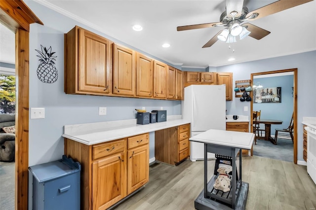 kitchen featuring white refrigerator, light hardwood / wood-style flooring, ceiling fan, and crown molding