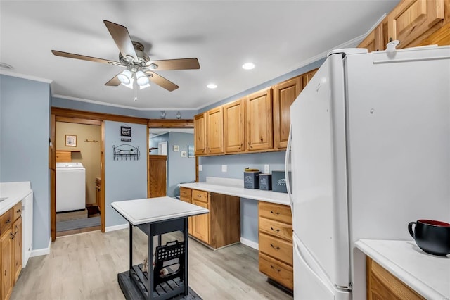 kitchen with light wood-type flooring, washer / dryer, white refrigerator, and ceiling fan