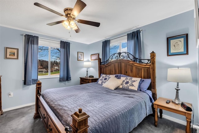 bedroom featuring multiple windows, ceiling fan, and dark colored carpet