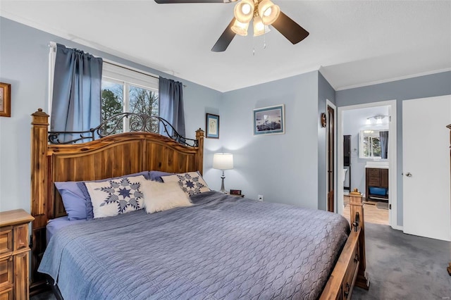 carpeted bedroom with ensuite bath and ceiling fan