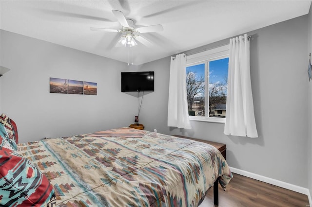 bedroom featuring wood-type flooring and ceiling fan