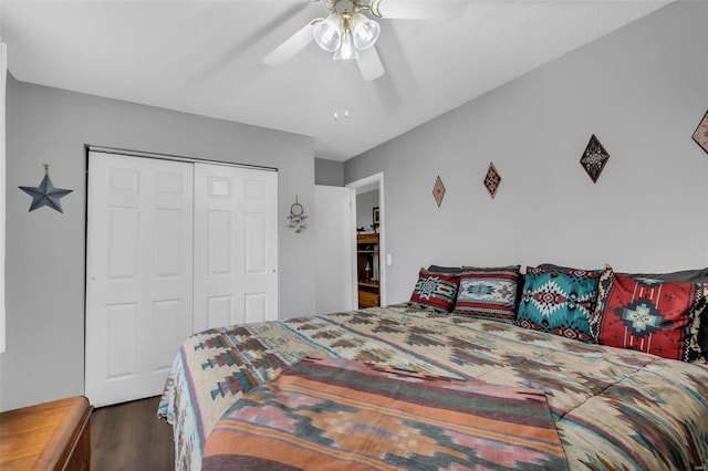 bedroom featuring dark hardwood / wood-style flooring, a closet, and ceiling fan