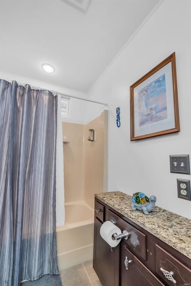 bathroom with tile patterned floors, vanity, shower / bath combo, and ornamental molding