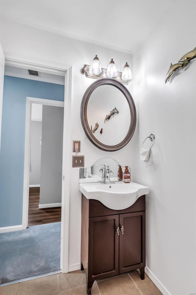 bathroom with tile patterned flooring and vanity