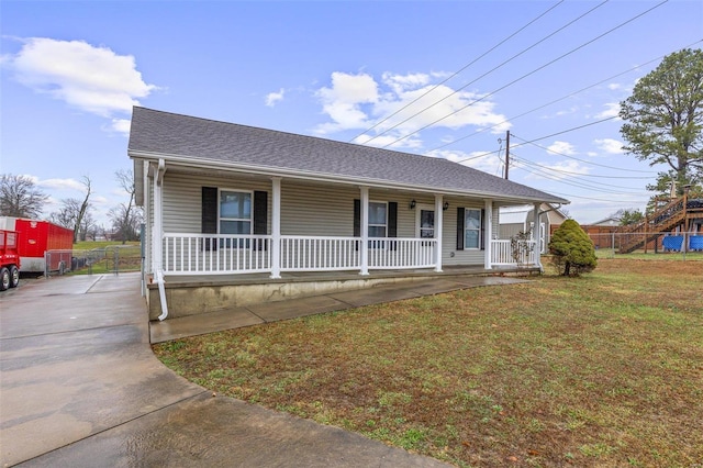 view of front of house featuring a front yard and a porch