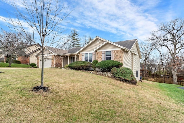 view of front facade with a front yard and a garage